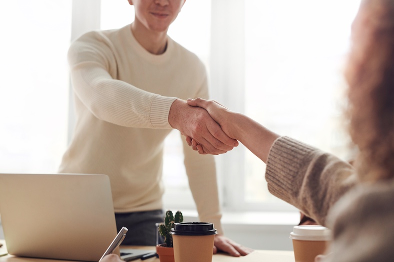 person shaking hand during an interview